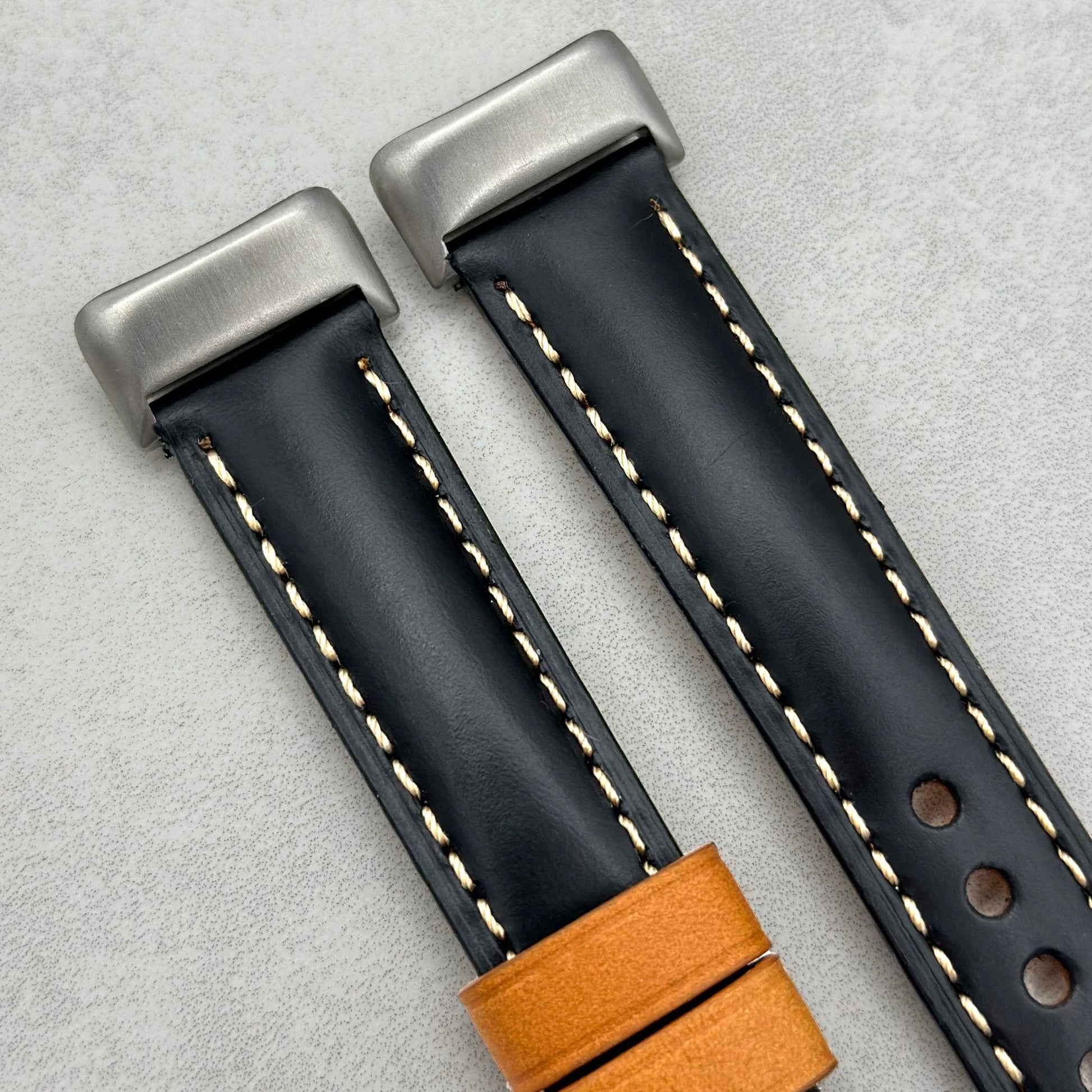 Top of the Oxford jet black full grain leather Fitbit Charge strap. Contrast ivory stitching. Watch And Strap