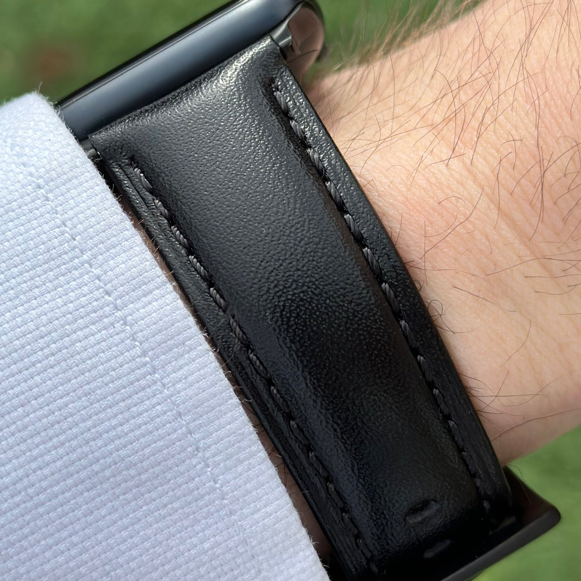 Wrist shot of the Prague jet black vegetable tanned leather watch strap on the Apple Watch series 9. Watch And Strap.