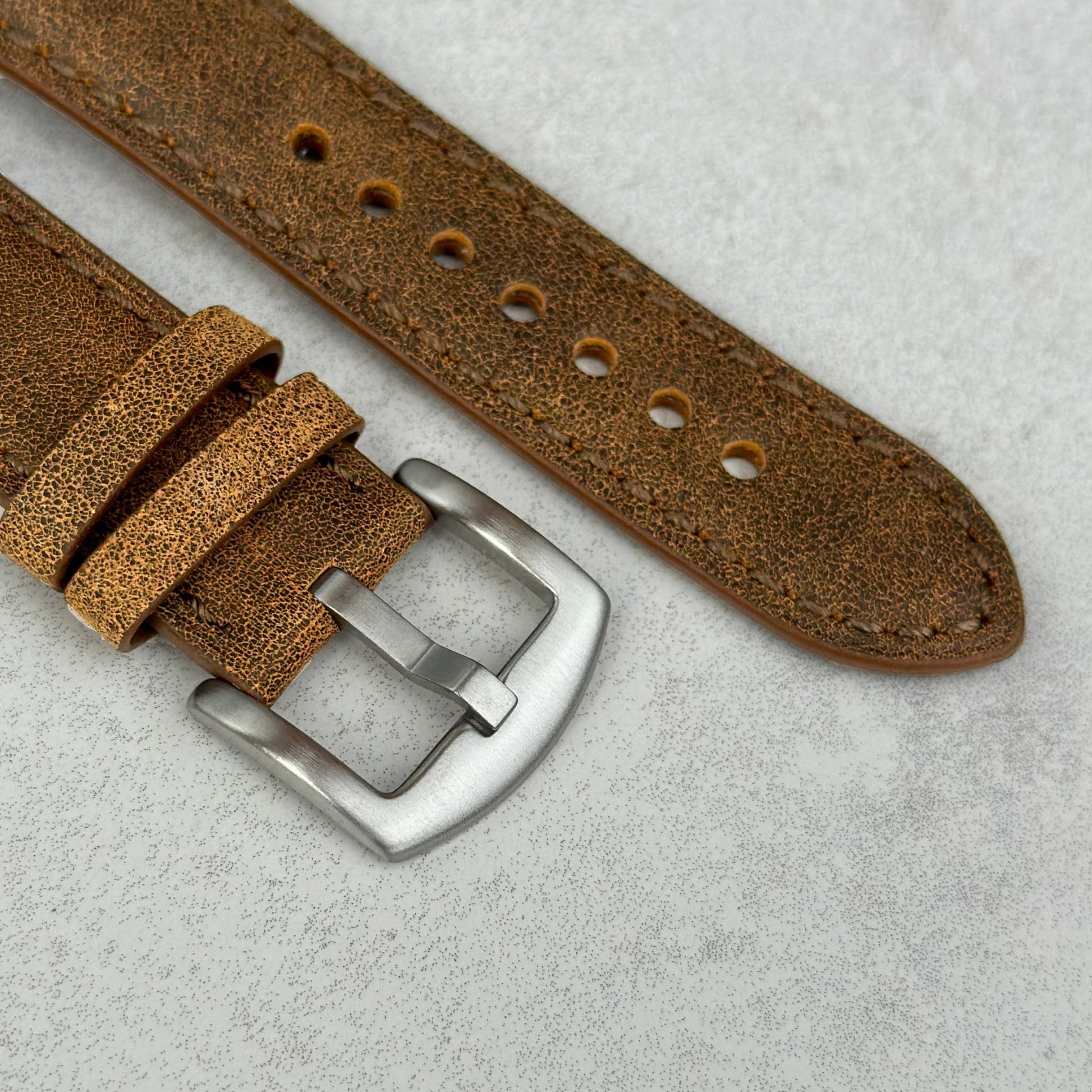 Brushed 316L stainless steel buckle on the Athens desert tan full grain leather watch strap.