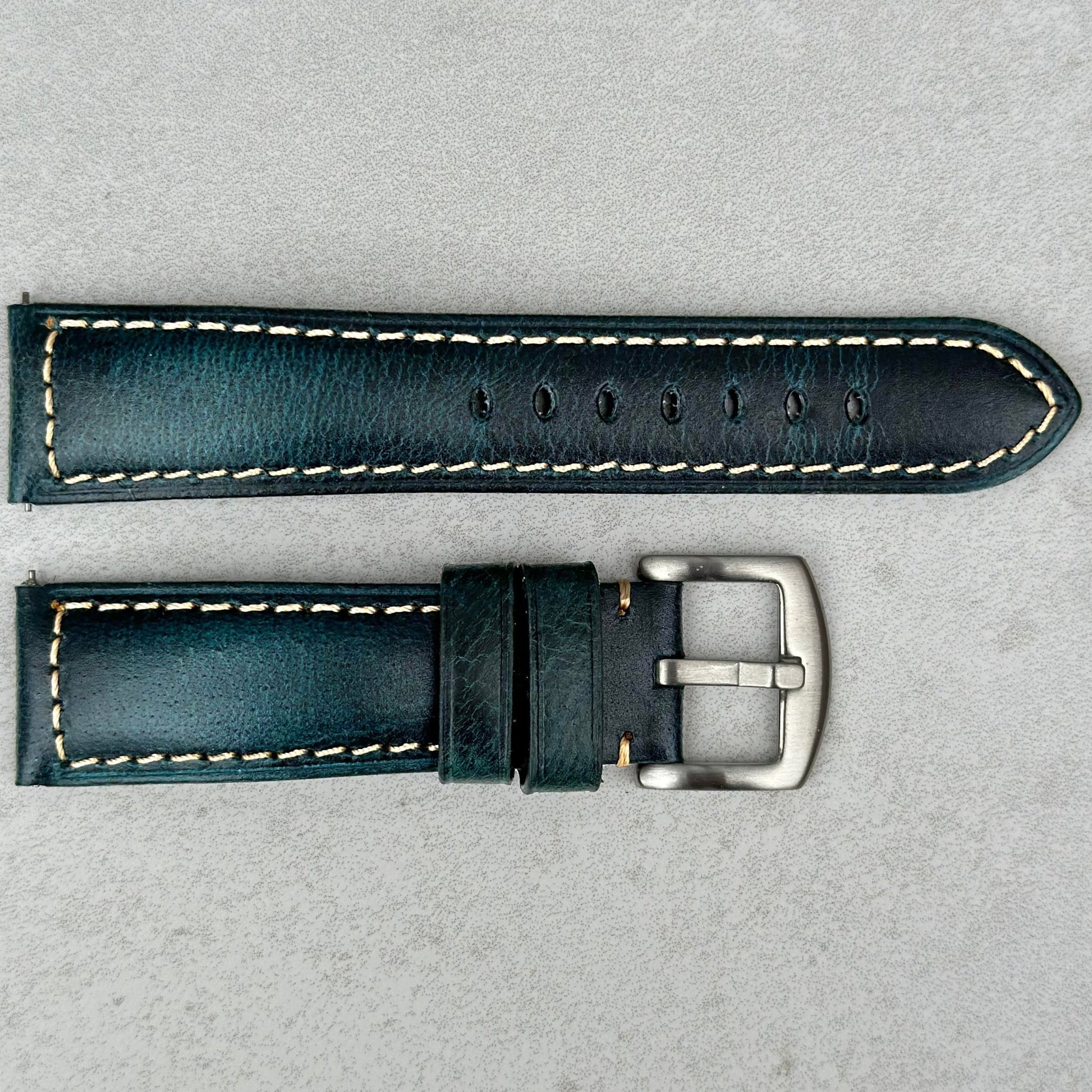 Berlin blue full grain leather watch strap. Contrast ivory stitching. Brushed 316L stainless steel buckle.