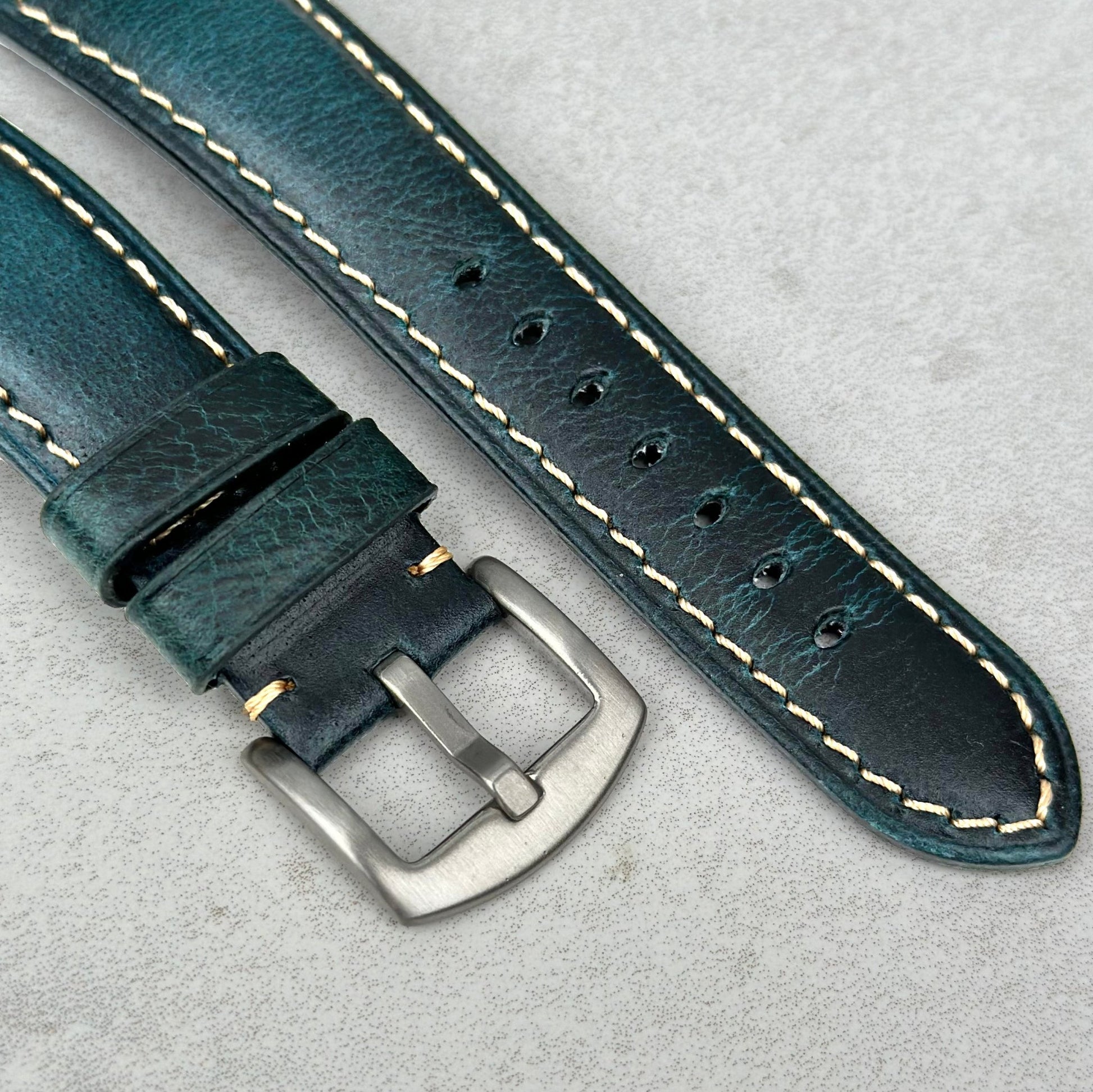 Brushed 316L stainless steel buckle on the Berlin blue full grain leather watch strap. Electric blue leather ivory stitching.