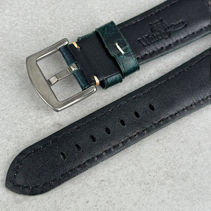Underside of the Berlin Blue full grain leather watch strap. Electric blue leather, ivory stitching, Watch And Strap logo.