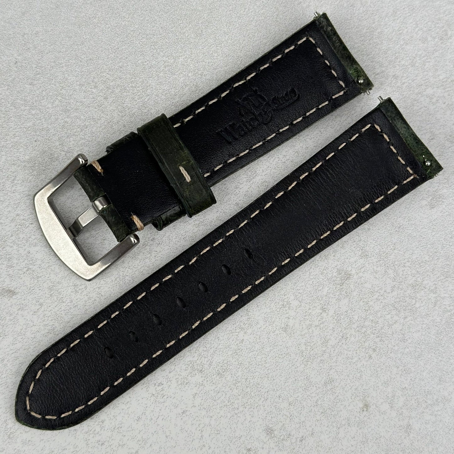 Rear of the Berlin green full grain leather watch strap. Watch And Strap logo. Quick release pins.