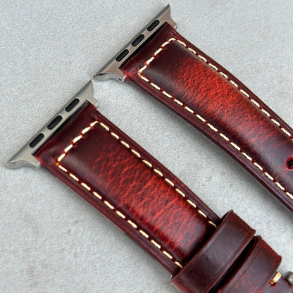 Top of the Berlin red full grain leather Apple Watch strap. Padded Apple Watch strap. Contrast ivory stitching.