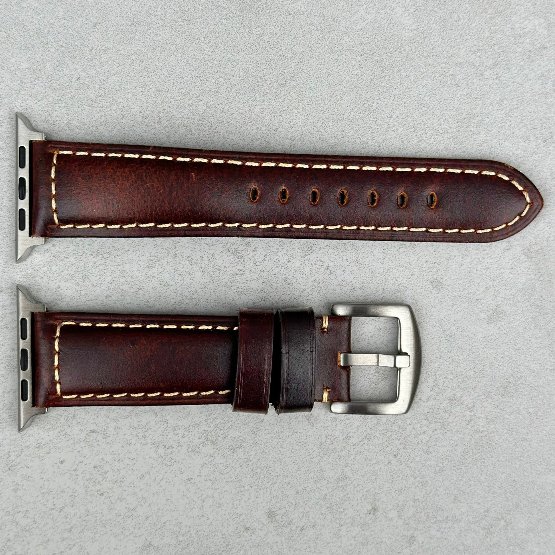 Berlin brown full grain leather Apple Watch strap. Contrast ivory stitching. Brushed stainless steel buckle. Watch And Strap