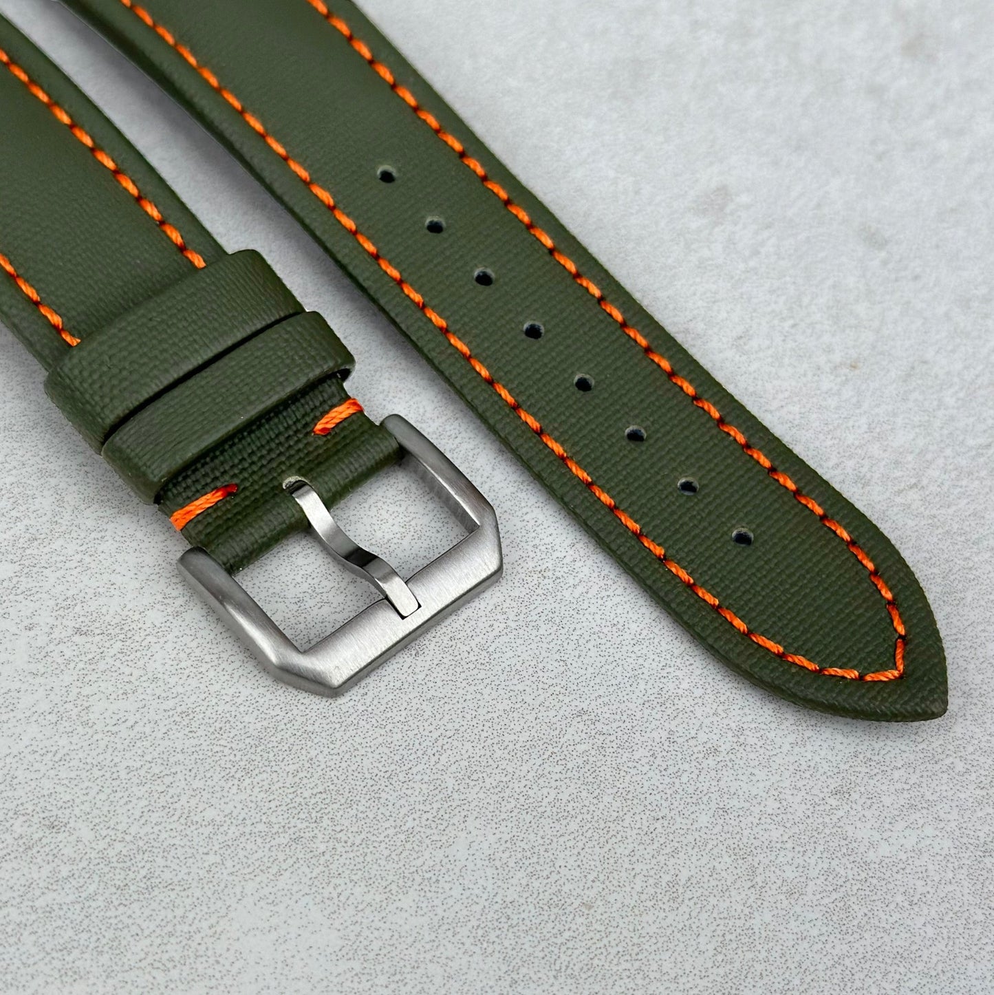 Brushed 316L stainless steel buckle on the Bermuda khaki green sail cloth watch strap with contrast ivory stitching.