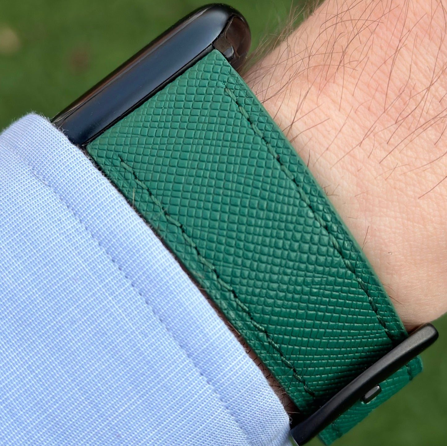 Wrist shot of the Florence emerald green Saffiano leather Apple Watch Strap. On the Apple Watch Series 9. Watch And Strap