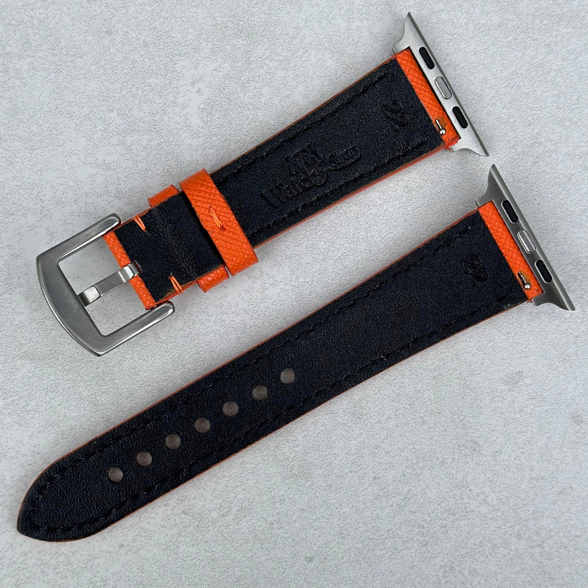 Rear of the Florence orange Saffiano leather Apple Watch strap. Watch And Strap logo. 316L stainless steel hardware.