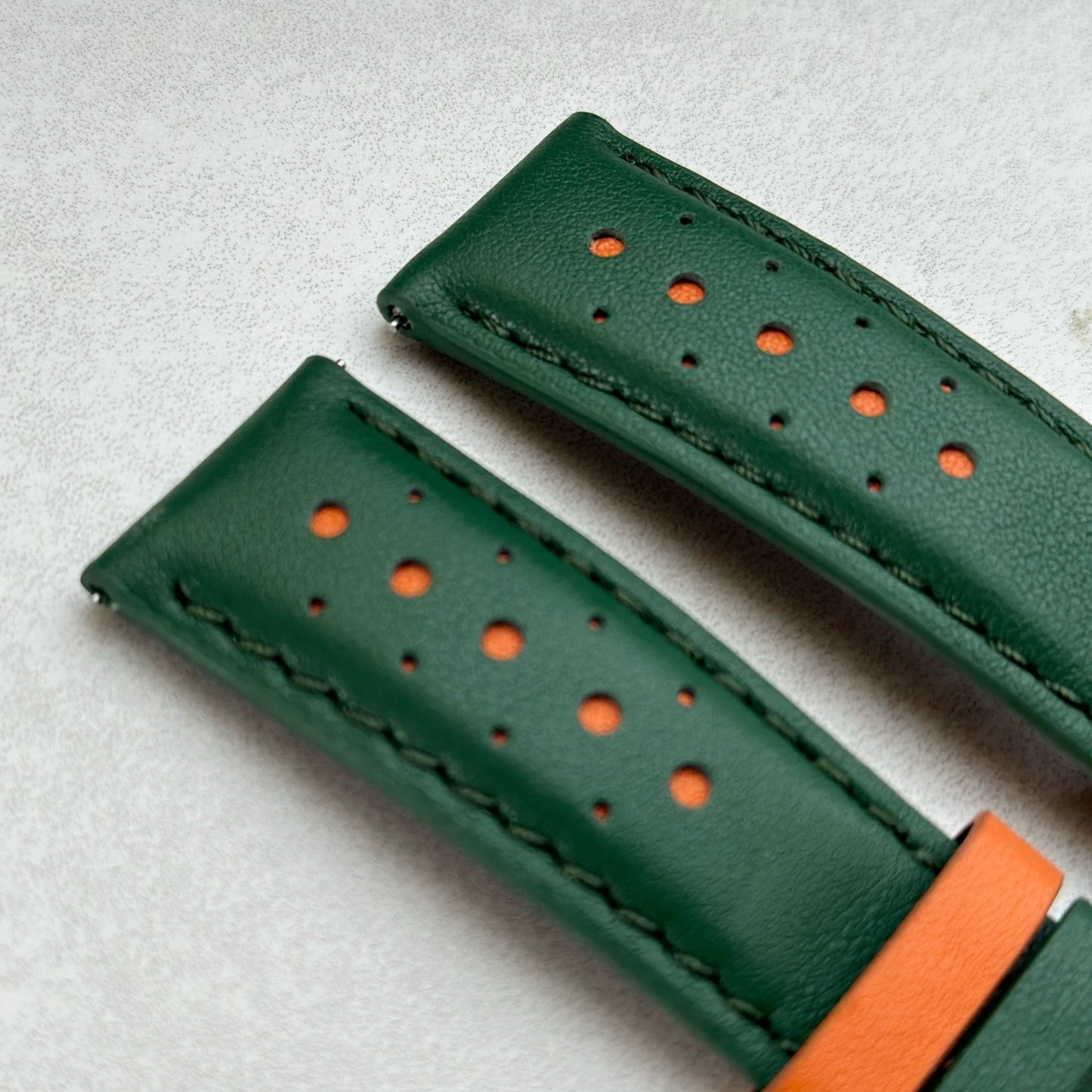 Le Mans green and orange full grain leather watch strap. Green leather with orange highlights. Padded leather strap.