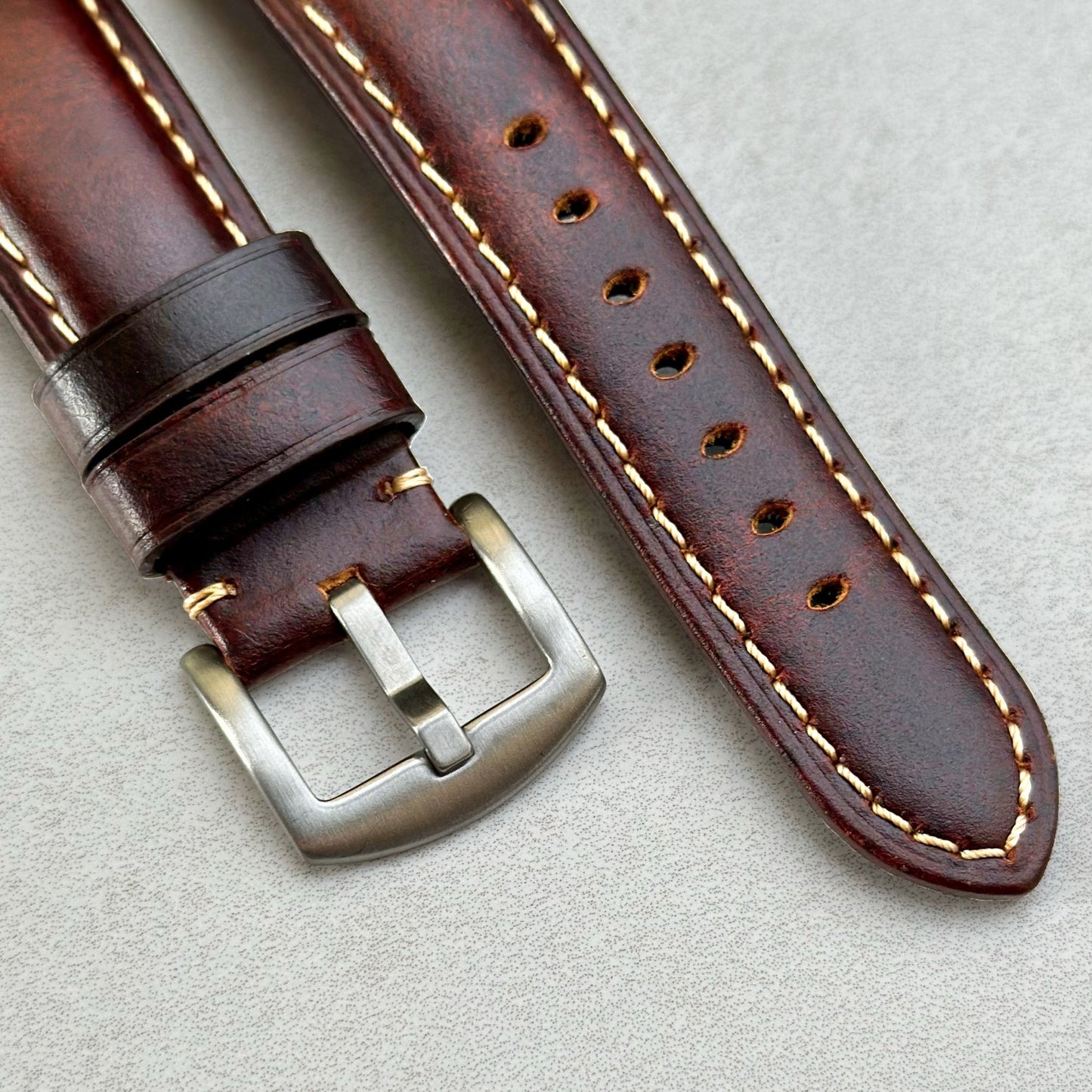 Brushed 316L stainless steel buckle on the Berlin tabaco brown full grain leather watch strap. Contrast ivory stitching.