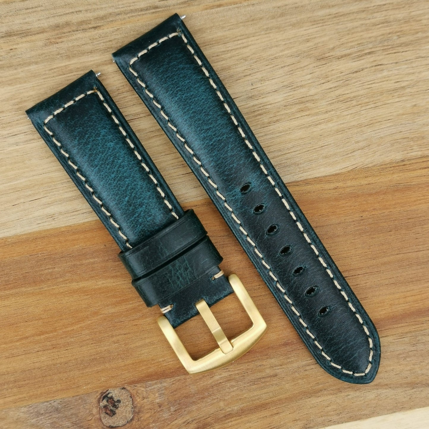 Berlin blue full grain leather watch strap with brushed gold 316L stainless steel buckle.