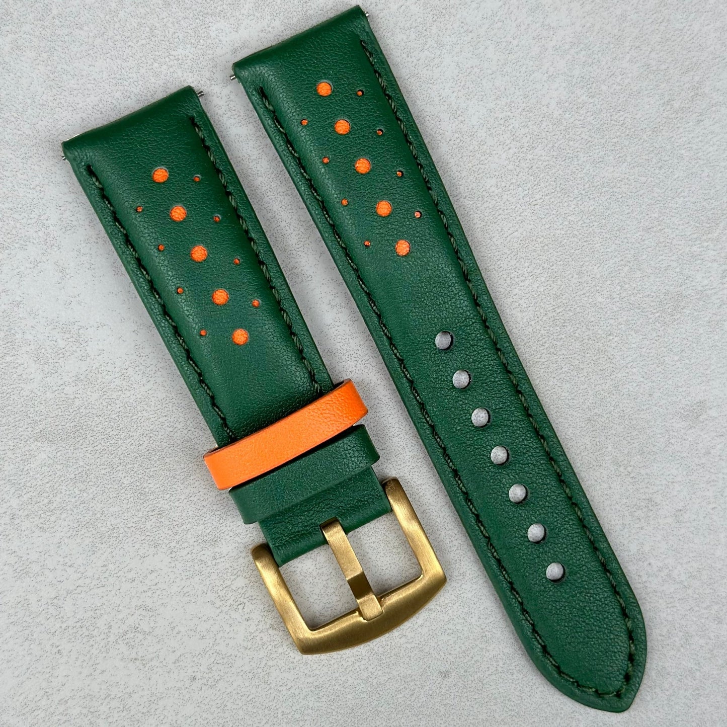 Le Mans green and orange leather watch strap, fitted with the brushed gold 316L stainless steel buckle.