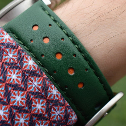 Wrist shot of the Le Man green and orange full grain leather watch strap. Watch strap placed on a males wrist.