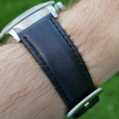 Wrist shot of the Milan black vegetable tanned full grain leather watch strap. Watch strap placed on the Tudor Blackbay 58.