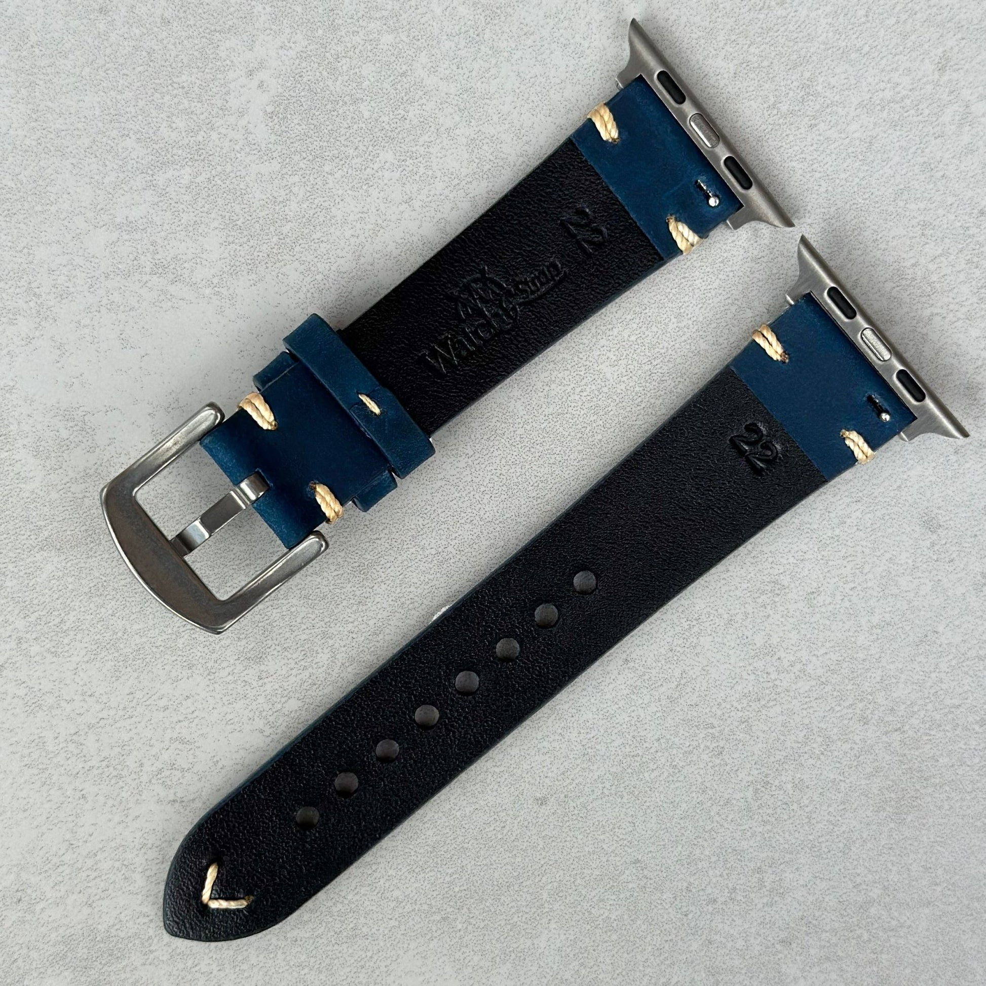 Rear of the Madrid midnight blue full grain leather Apple Watch strap. Watch And Strap logo.
