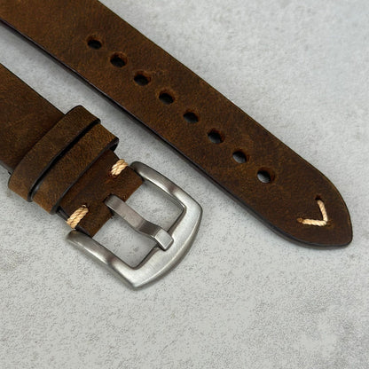 Brushed 316L stainless steel buckle on the Madrid chocolate brown full grain leather apple watch strap.