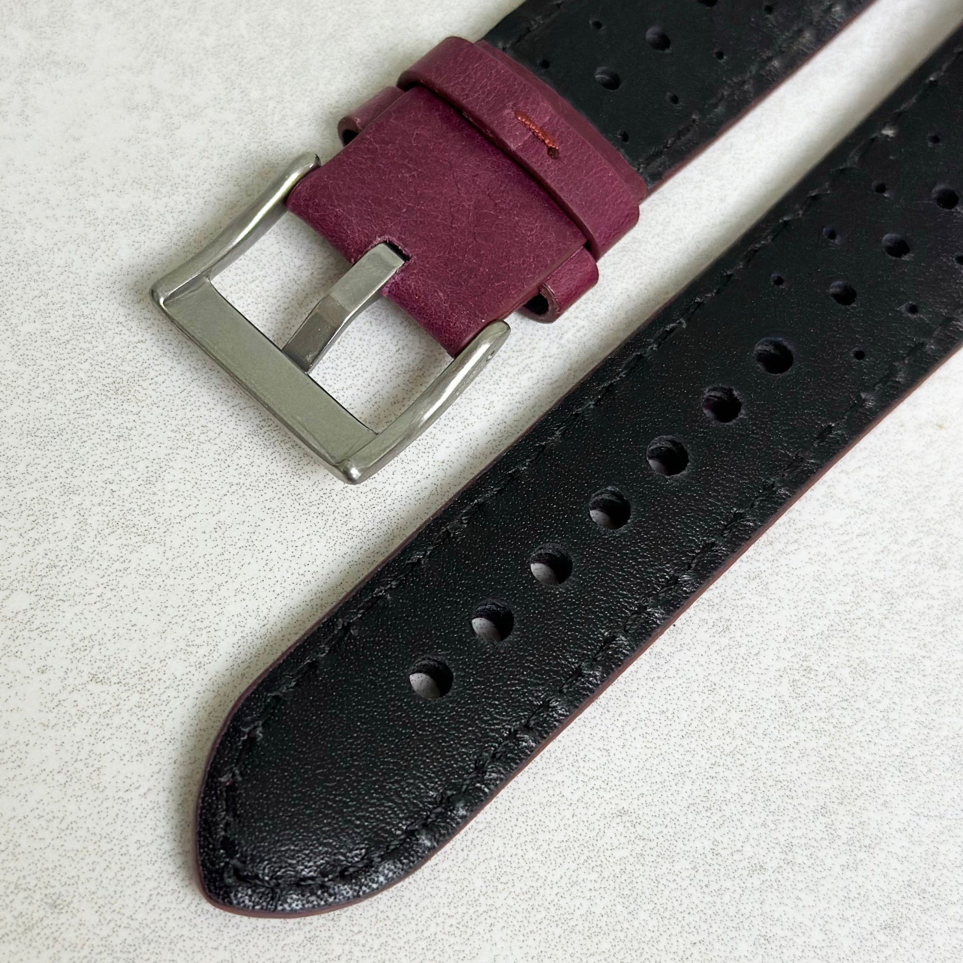 Underside of the brushed 316L stainless steel buckle on the Montecarlo plum purple full grain leather watch strap.