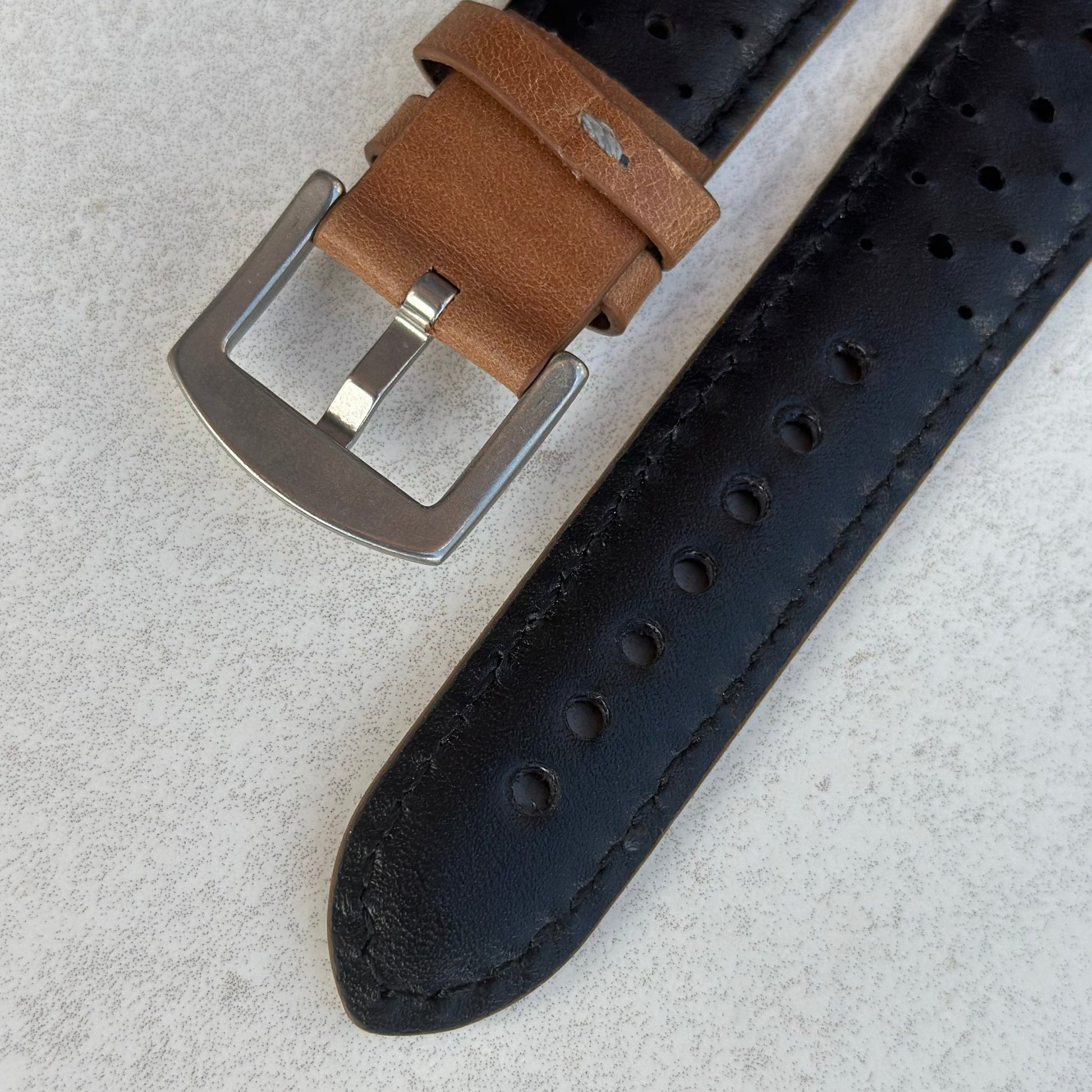 Underside of the buckle on the Montecarlo tan full grain leather Apple Watch strap. Perforated leather Apple Watch strap.