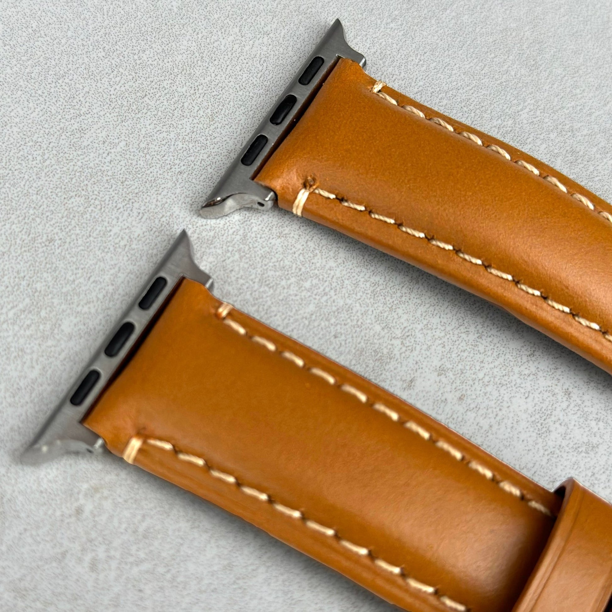 Top of the Oslo tan full grain leather Apple Watch strap. Brushed 316L stainless steel hardware. Watch And Strap