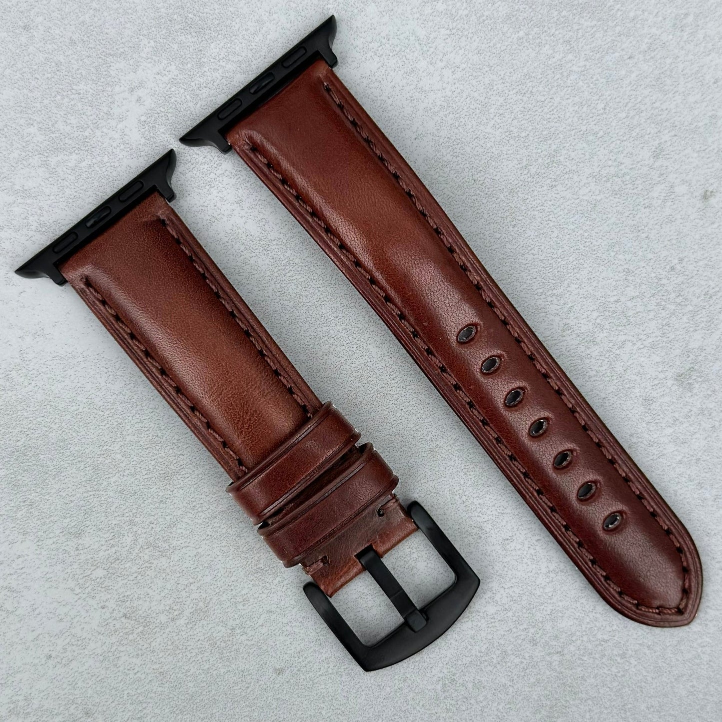 The Prague Chestnut brown vegetable tanned leather Apple Watch strap. PVD Black. Series 3, 4, 5, 6, 7, 8, 9, SE and Ultra.