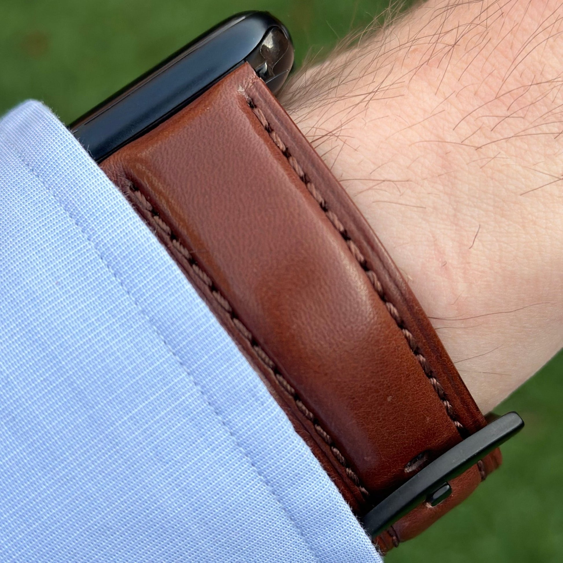 Prague chestnut brown vegetable tanned leather watch strap on the Apple Watch Series 9 black. Watch And Strap.