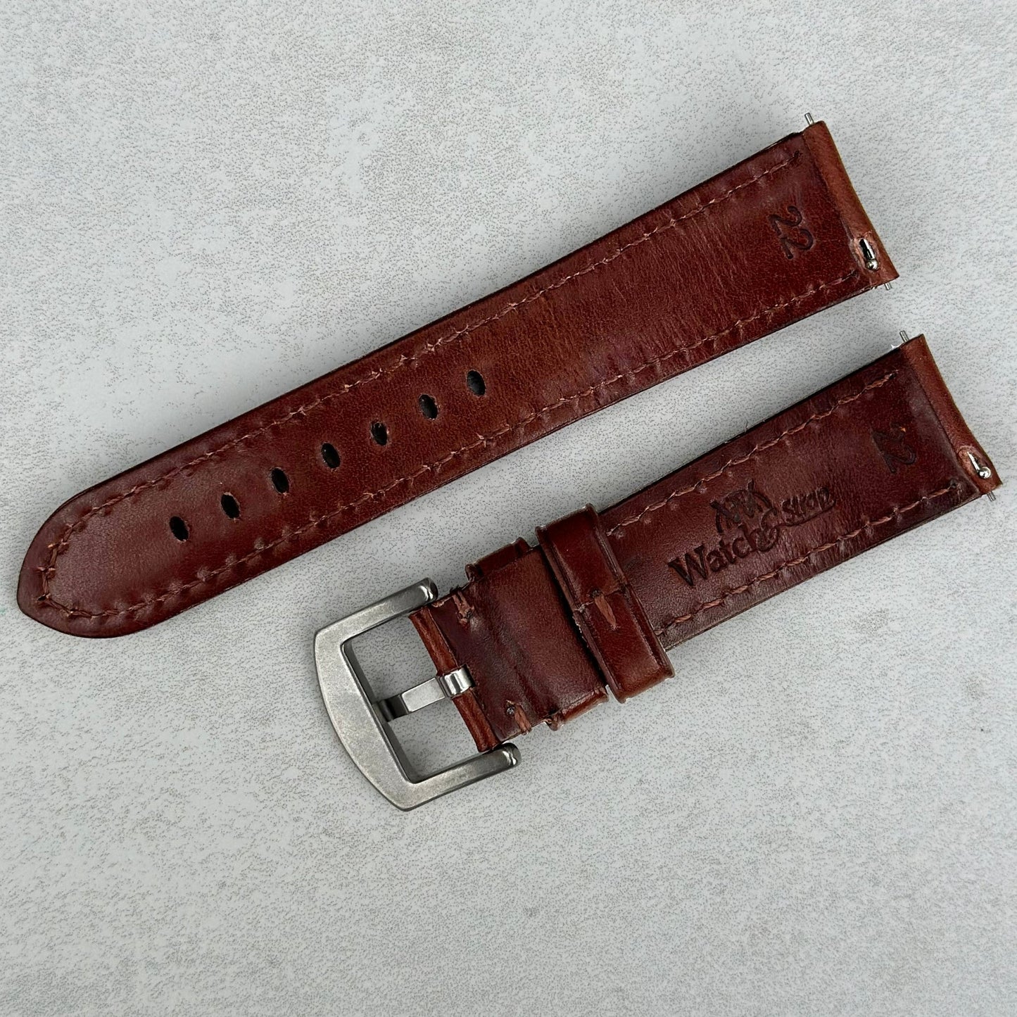 Rear of the Prague chestnut brown vegetable tanned leather watch strap. Watch And Strap logo. Quick release pins.