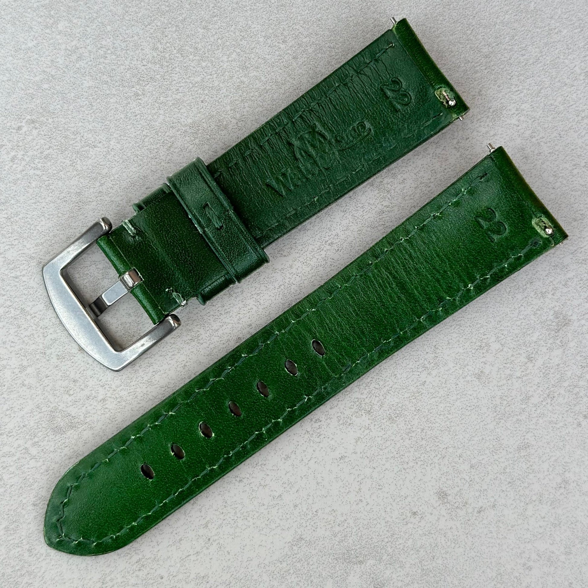 Rear of the Prague racing green vegetable tanned leather watch strap. Quick release pins. Watch And Strap logo.